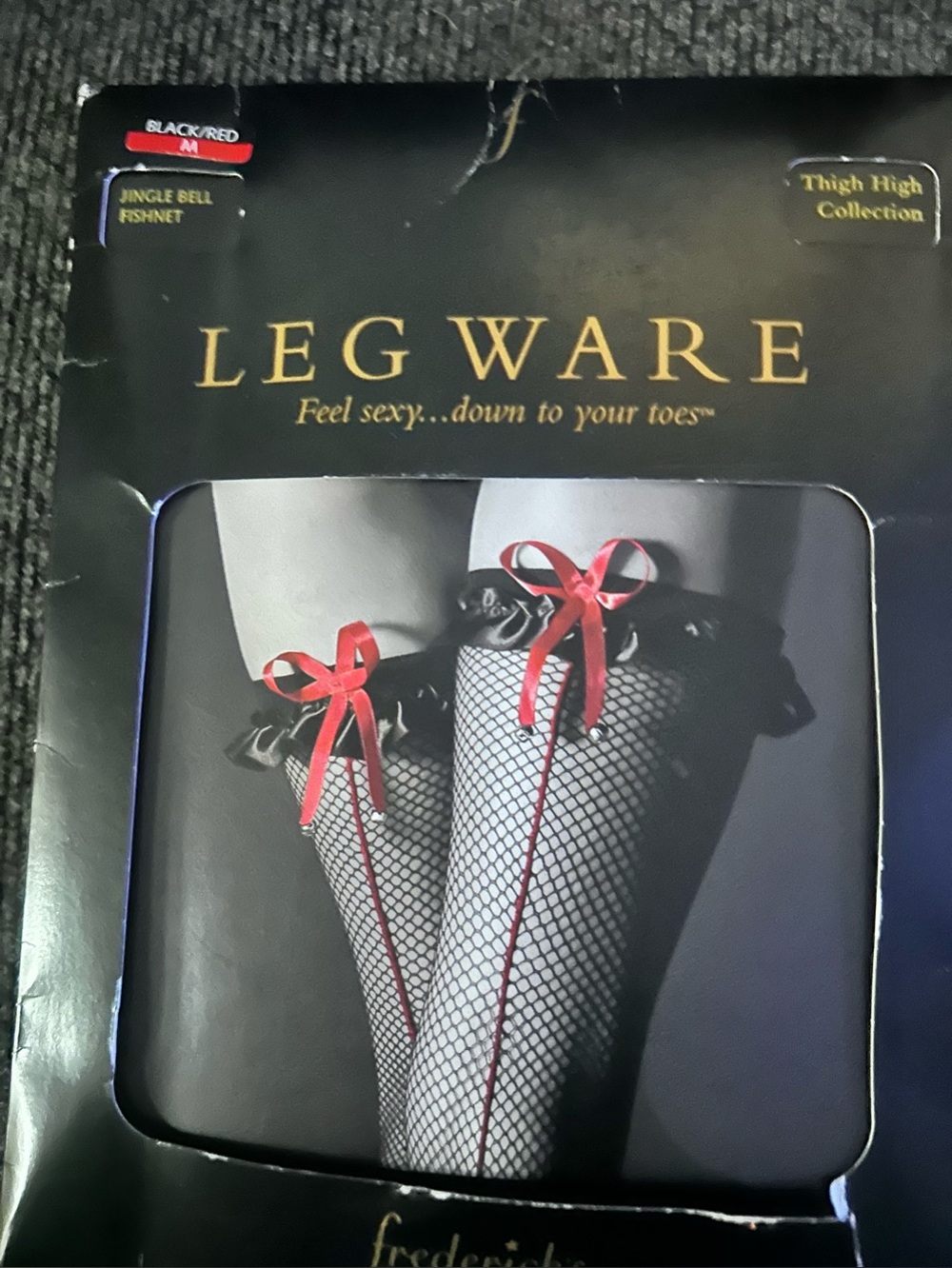 Frederick's of Hollywood Black Fishnet Thigh-Highs with Red Ribbon